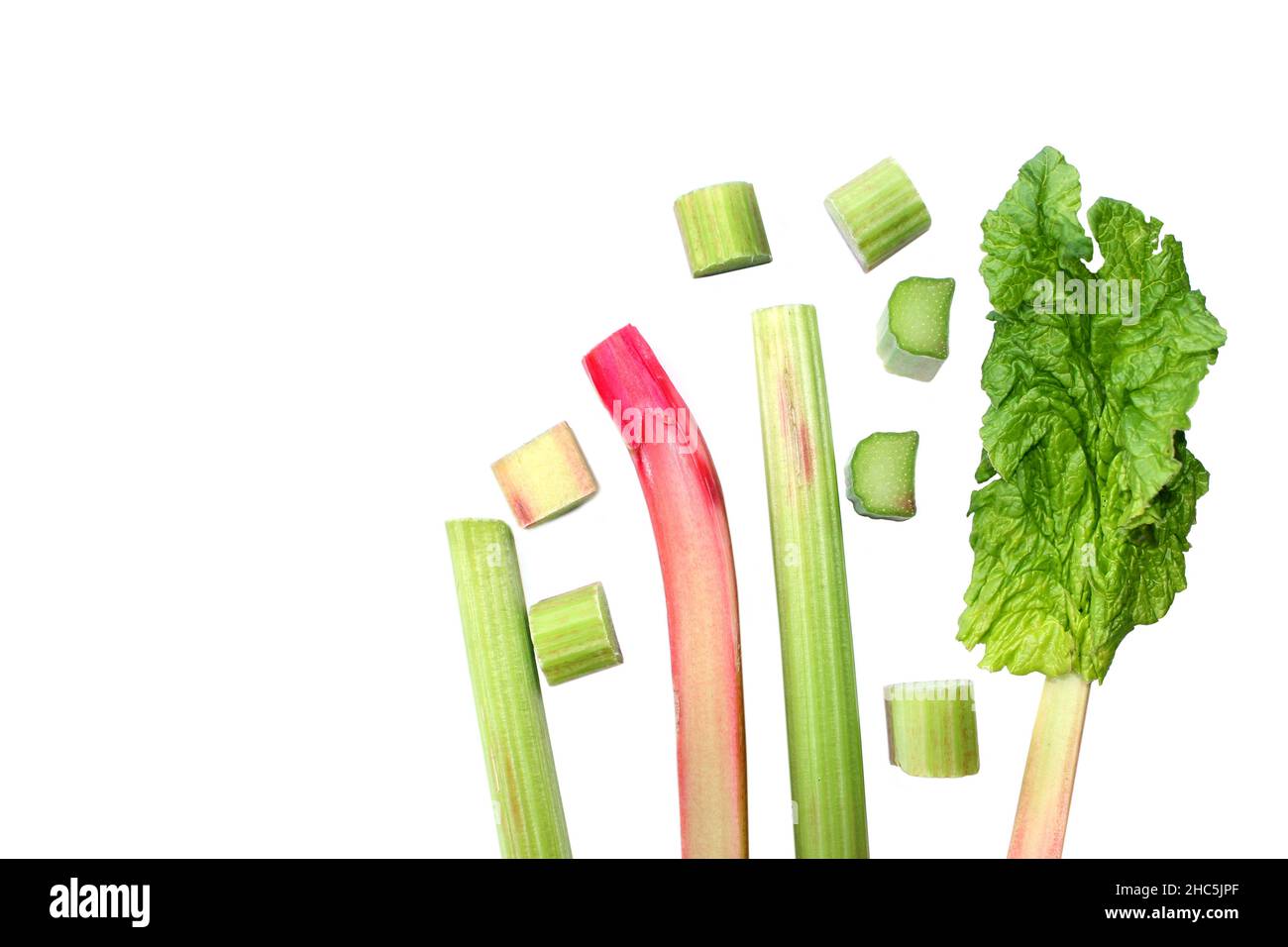 Fresh rhubarb. Red and green stems, whole and cut. Stock Photo