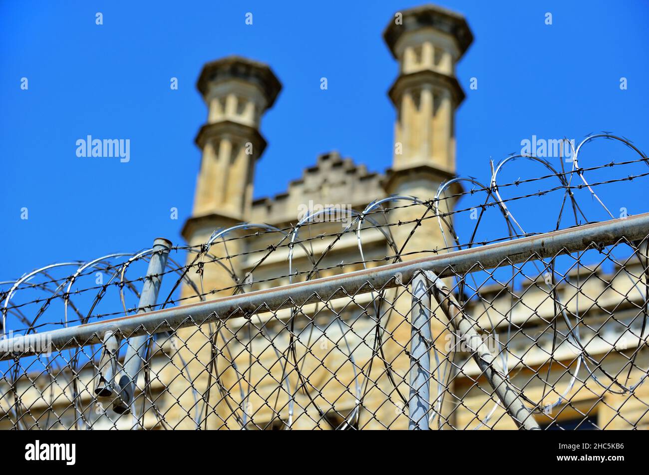 Joliet, Illinois, USA. Barbed wire atop a fence at the Joliet Correctional Center (originally known as Illinois State Penitentiary and Joliet Prison). Stock Photo