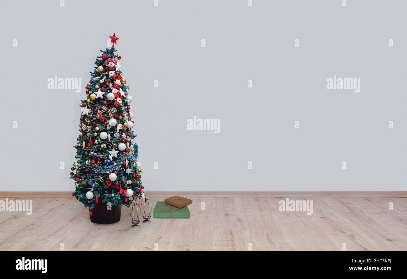 christmas tree on hardwood floor Stock Photo
