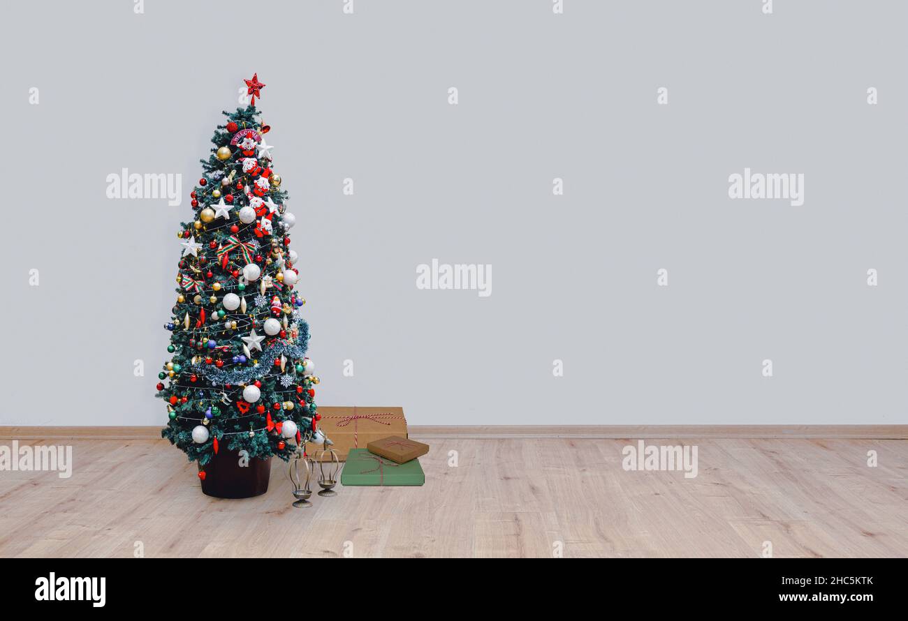 christmas tree on hardwood floor Stock Photo