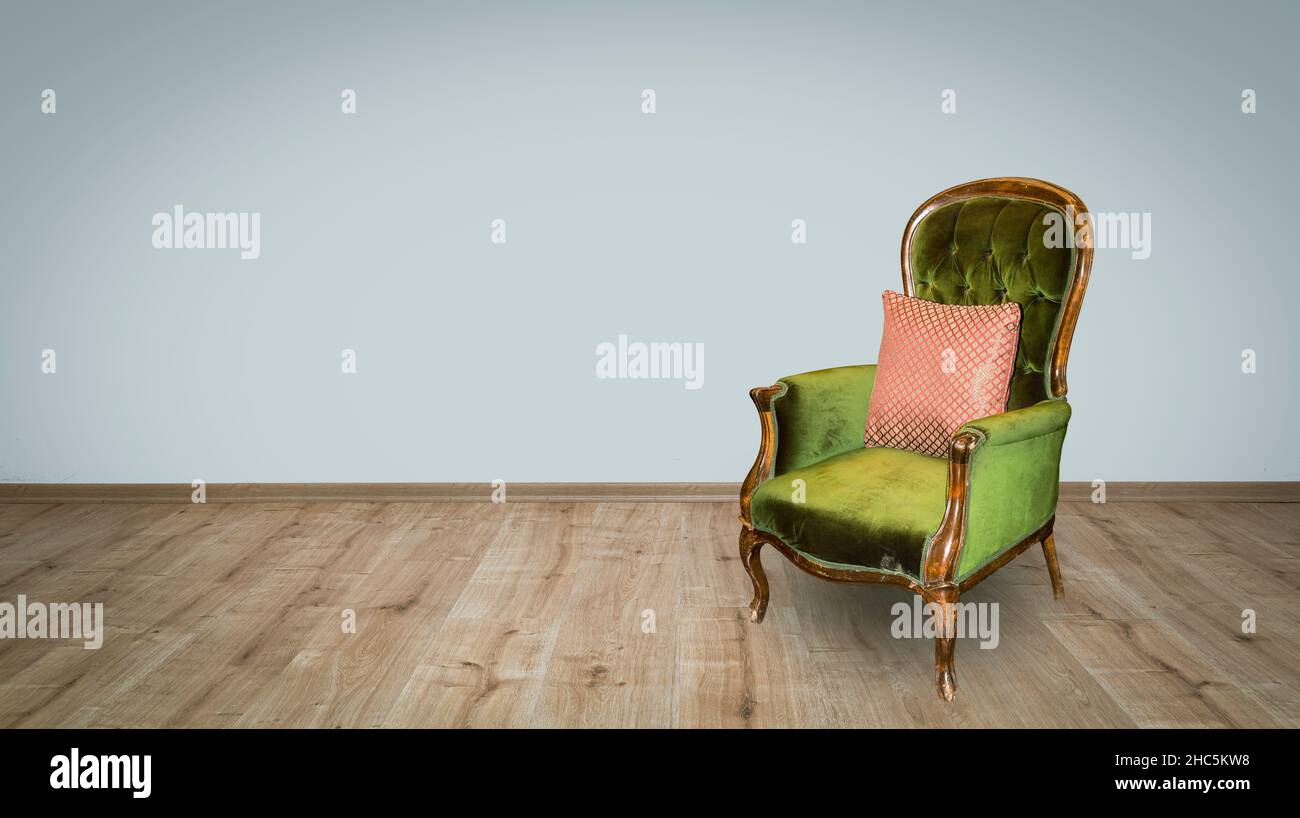 hardwood floor vintage armchair in the house Stock Photo - Alamy