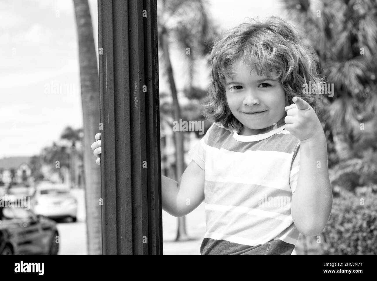 Do what makes you happy. Child smile pointing finger. Playful boy summer outdoors. Happy boyhood Stock Photo