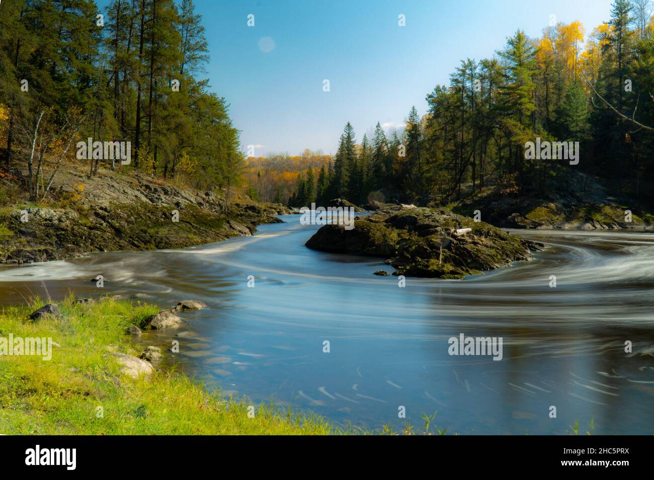 Beautiful shot of a lake in a forest during the day Stock Photo - Alamy