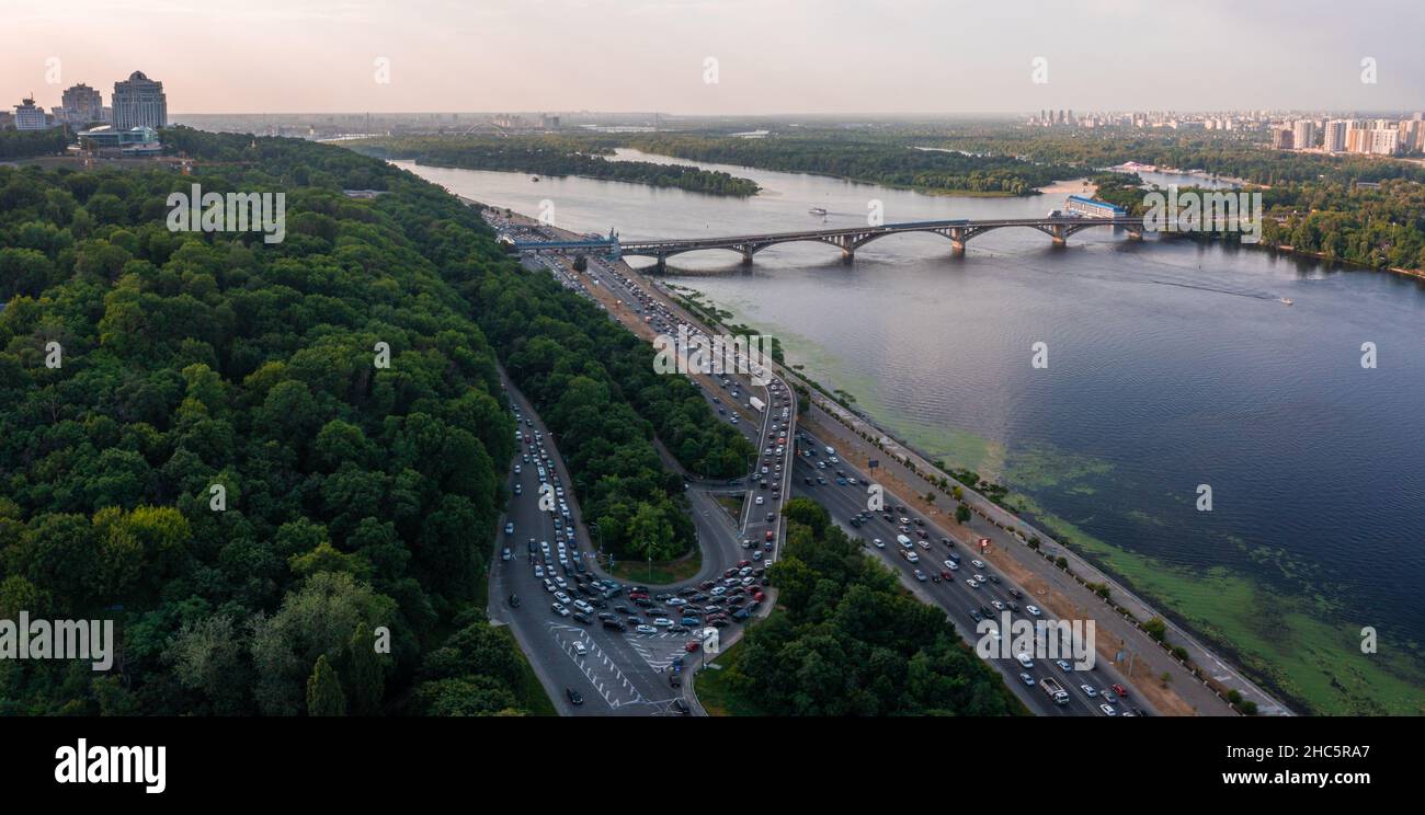 Aerial view of road bridge across river with heavy traffic jam in one ...