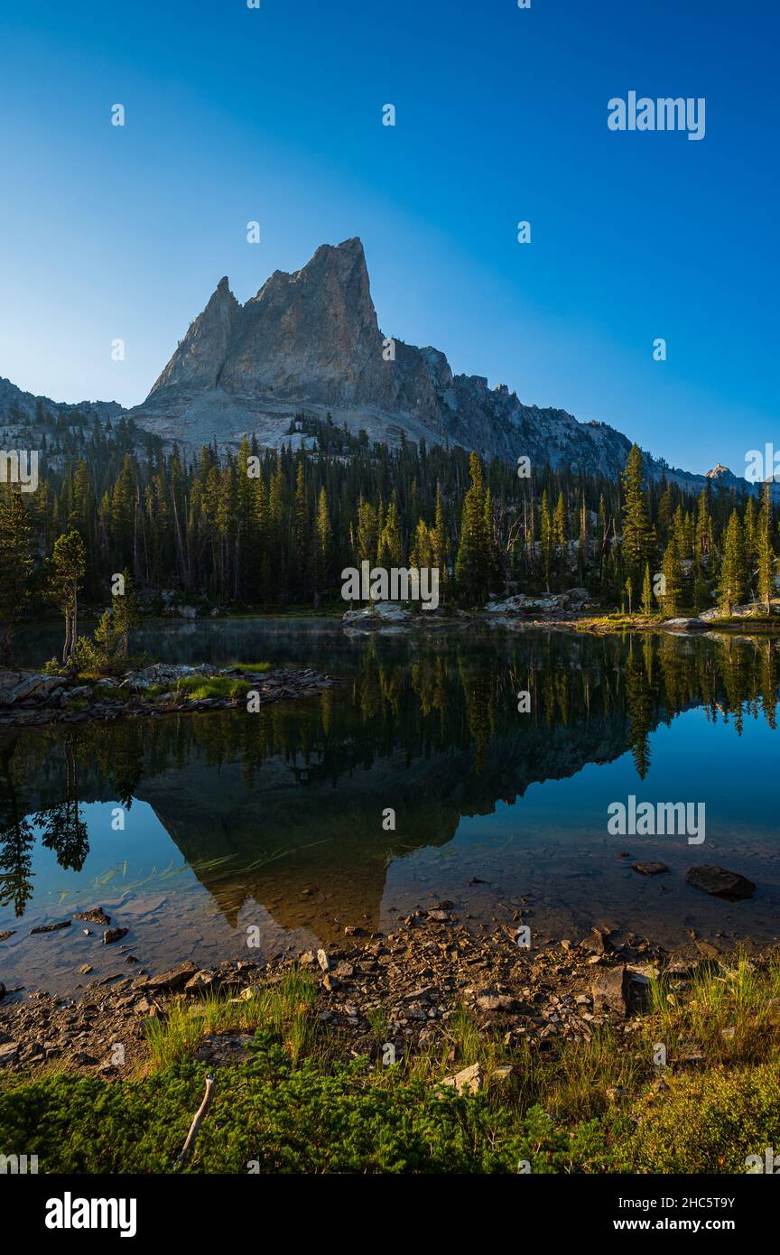 Mesmerizing view of the reflection of the Sawtooth Mountains in the  Alice Lake Stock Photo