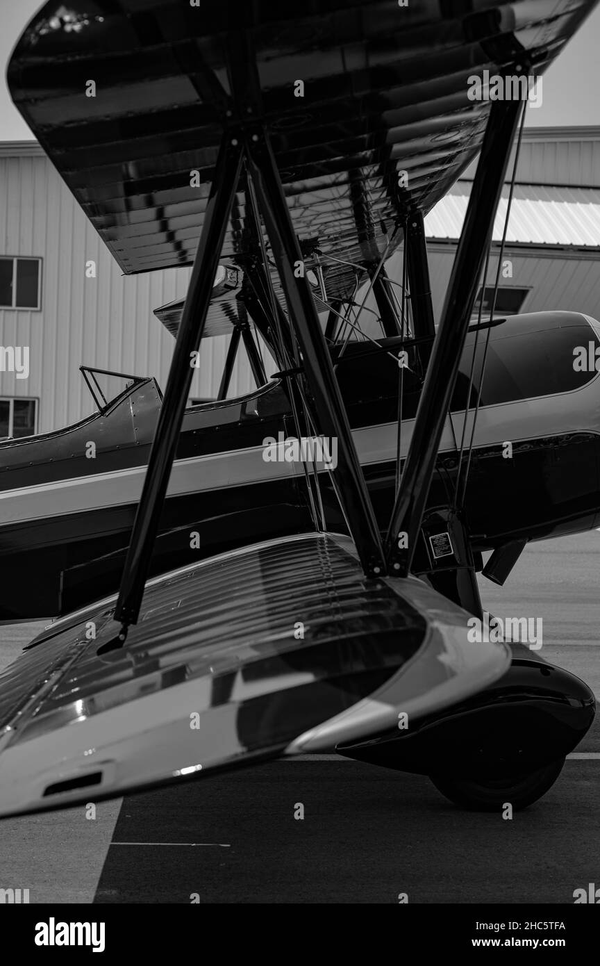 Vertical grayscale image of a modern biplane with a beautiful design Stock Photo