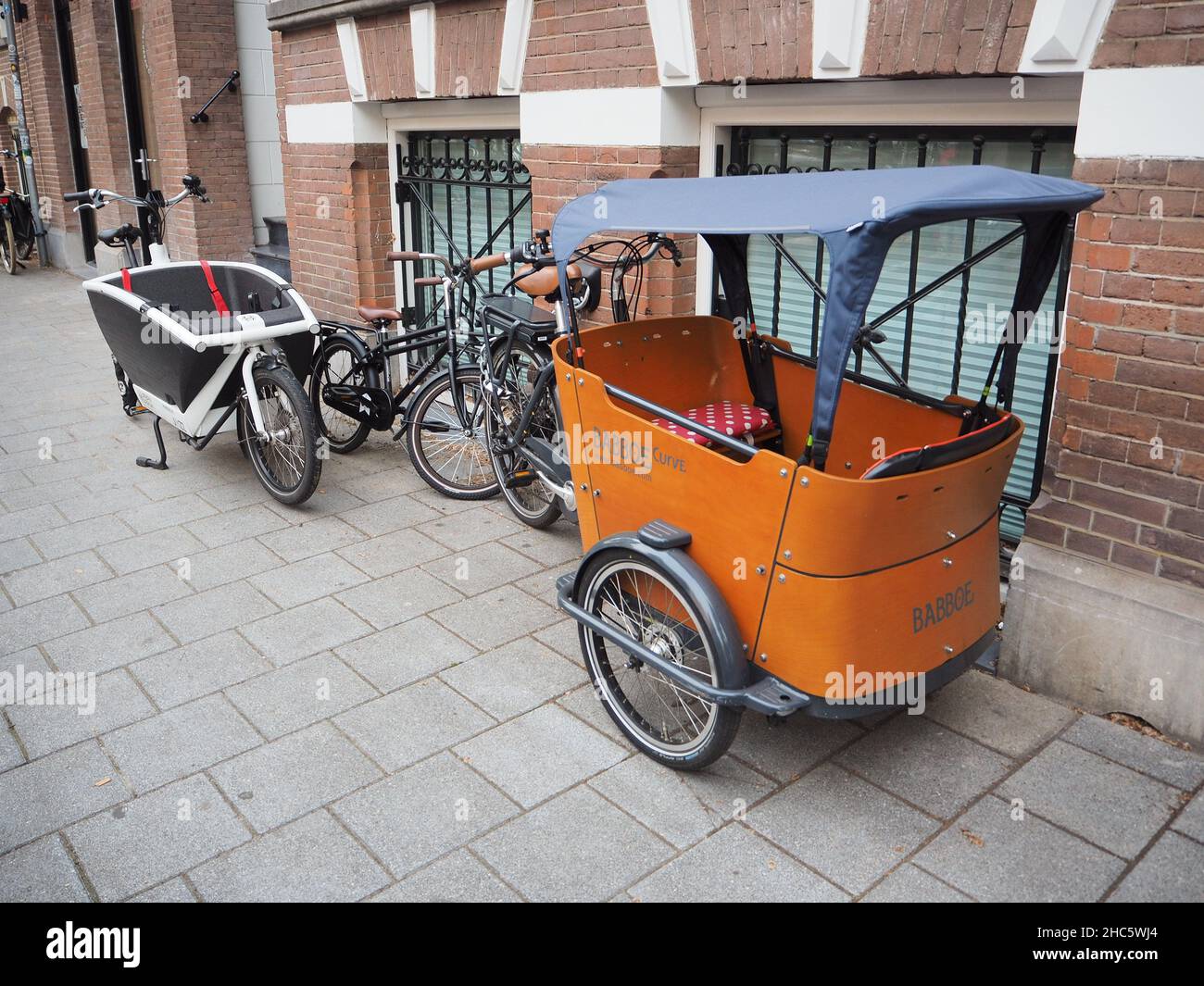 Small cargo bike in the streets of Amsterdam Stock Photo