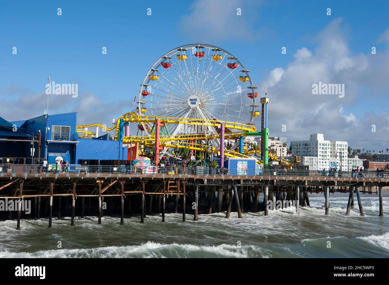 Amusement rides and Ferris Wheel at the Santa Monica Pier, Los Angeles, CA Stock Photo
