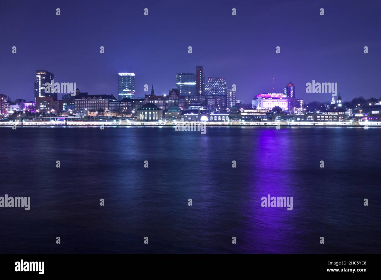 Landungsbruecken and the harbor at night in hamburg hires stock