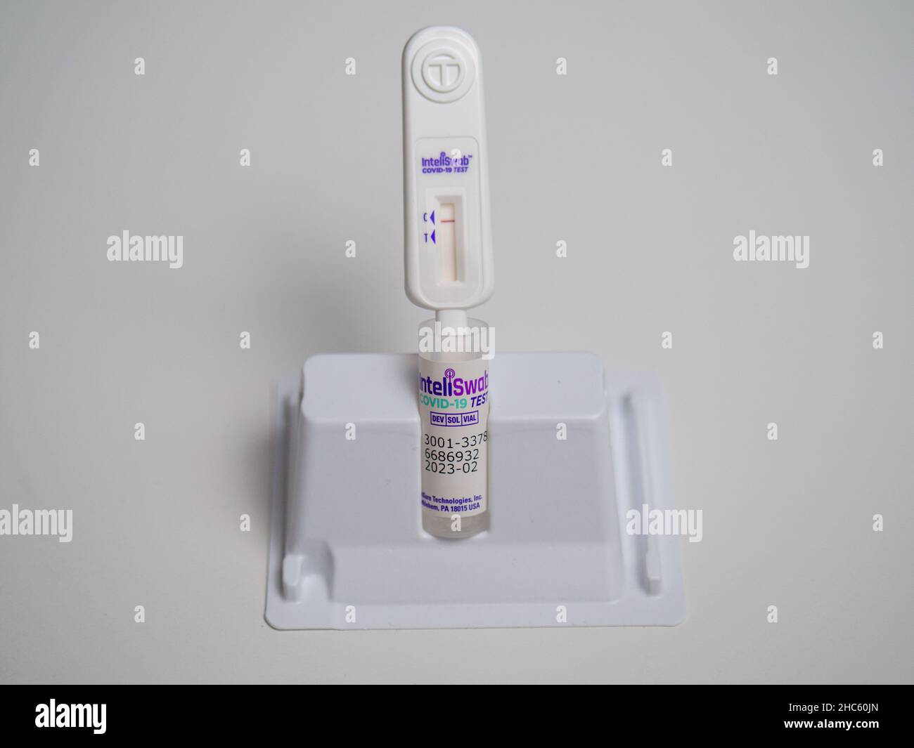 COVID-19 home antigen test kit. Test shows negative result, control area reacted, test area did not. Stock Photo