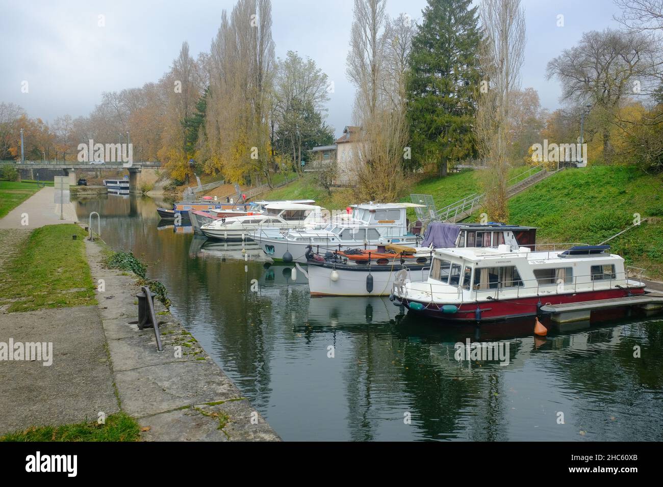 Bright autumn morning with tourist boats parked at the port in Besancon ...