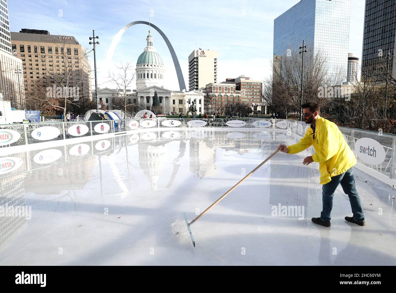 St. Louis, United States. 24th Dec, 2021. Ice attendant Eric Jablonski squeegees the water from the ice before opening at the Winterfest Ice Skating rink in Kiener Plaza in St. Louis on Friday December 24, 2021. A temperature of 73 degrees broke the 70-degree record set on December 16, 1889. Photo by Bill Greenblatt/UPI Credit: UPI/Alamy Live News Stock Photo