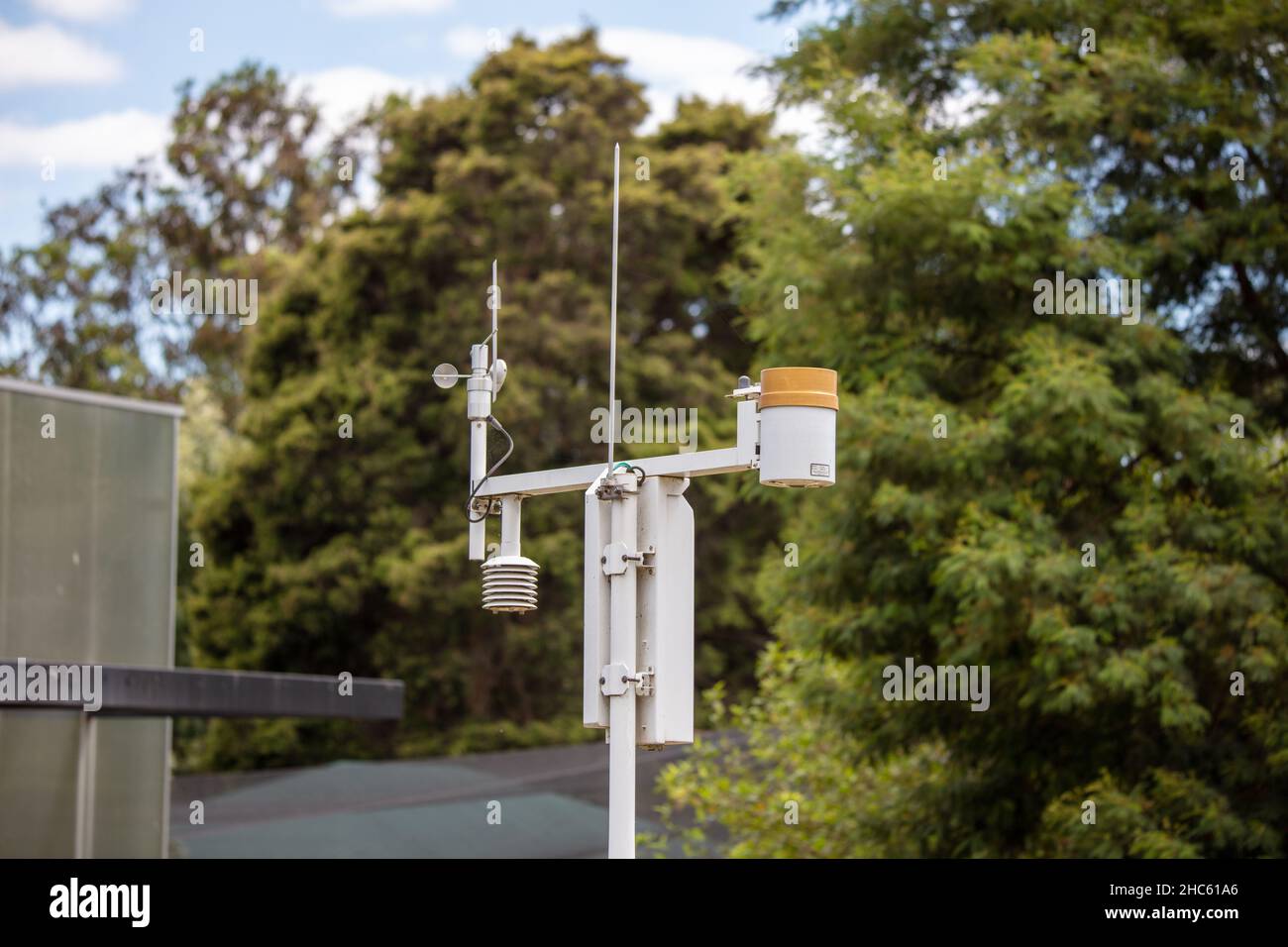 Closeup of a weather barometer, i.e. a rain gauge outdoors surrounded