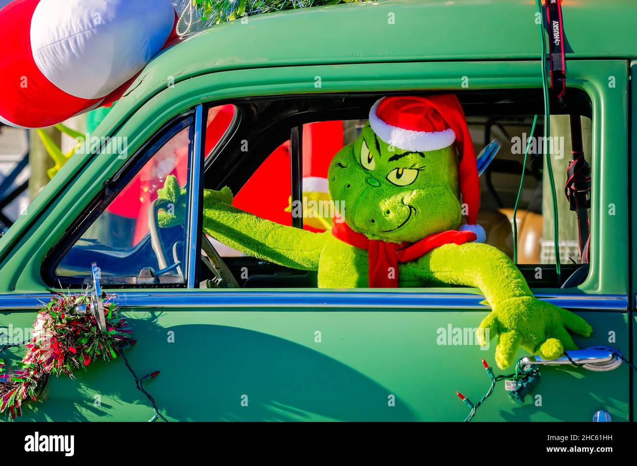 A beach house features Grinch-themed Christmas decorations, Dec. 24, 2021, in Dauphin Island, Alabama. Stock Photo