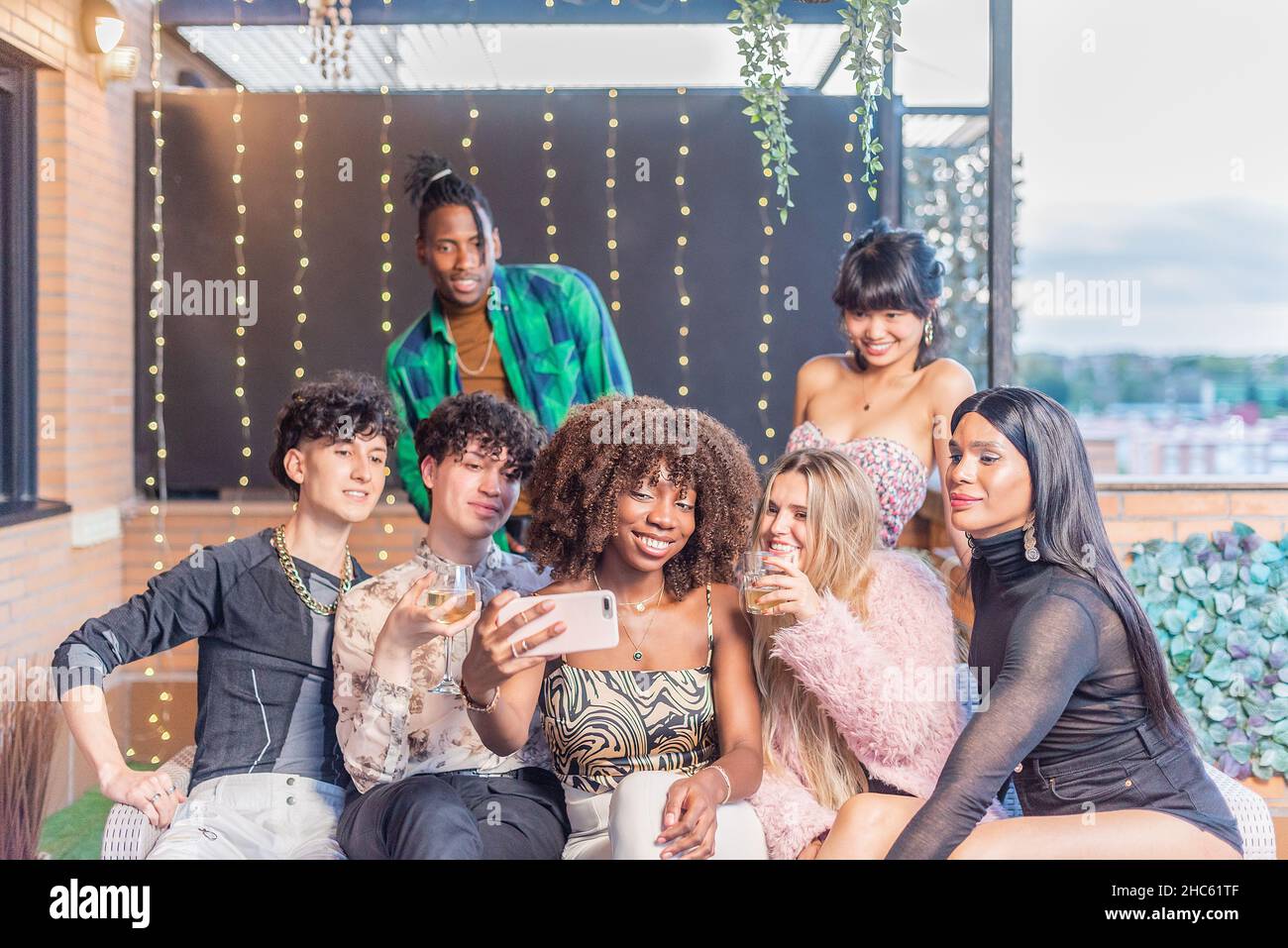 Multi-ethnic friends taking a selfie on a terrace Stock Photo
