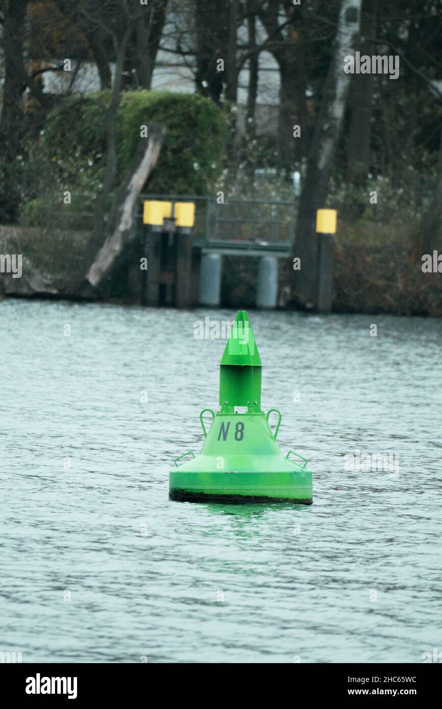Close up of a green buoy written on it N 8 floating in a lake Stock