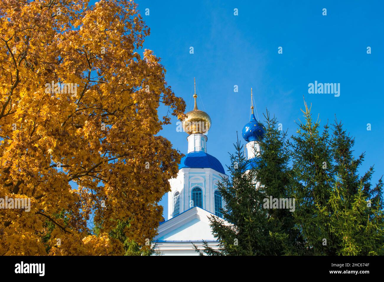 Two domes of the church with the cross with blue sky on the background in Tambov, Russia Stock Photo