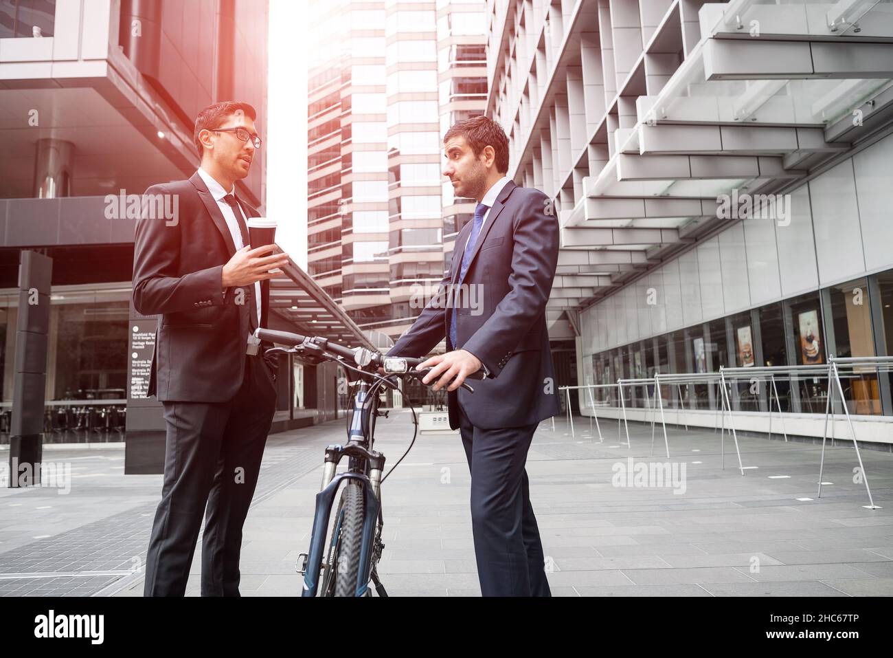 Two businessmen having walk Stock Photo - Alamy