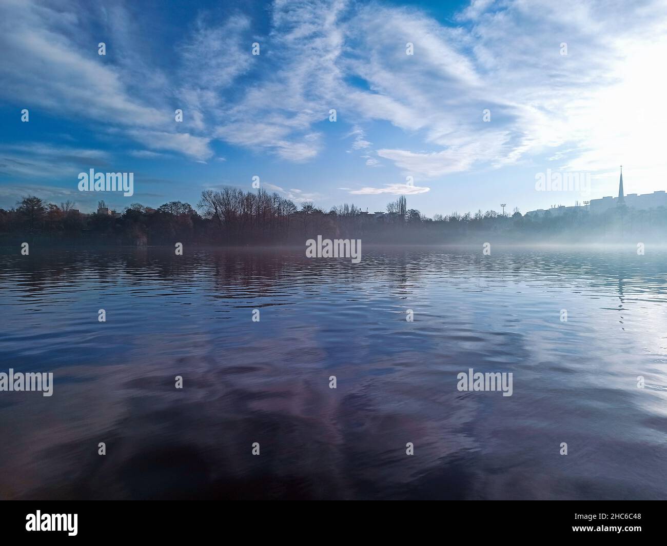 Beautiful landscape and the sun reflecting in the lake Stock Photo - Alamy