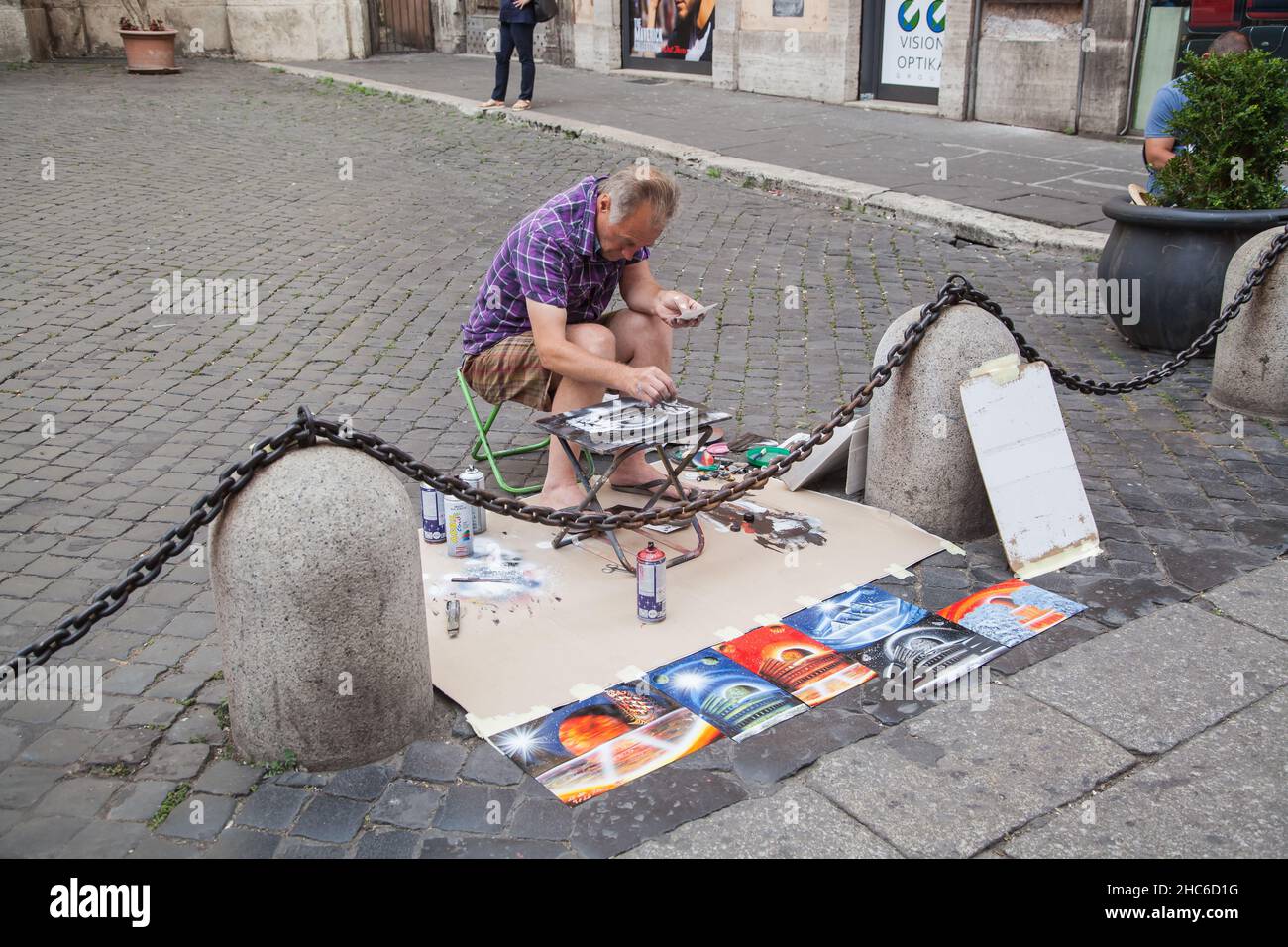 Painter at piazza San Marcello al Corso in Rome. Stock Photo