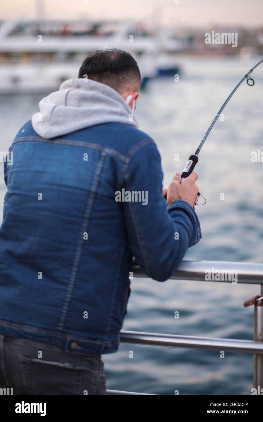 Man catching a fish hi-res stock photography and images - Alamy