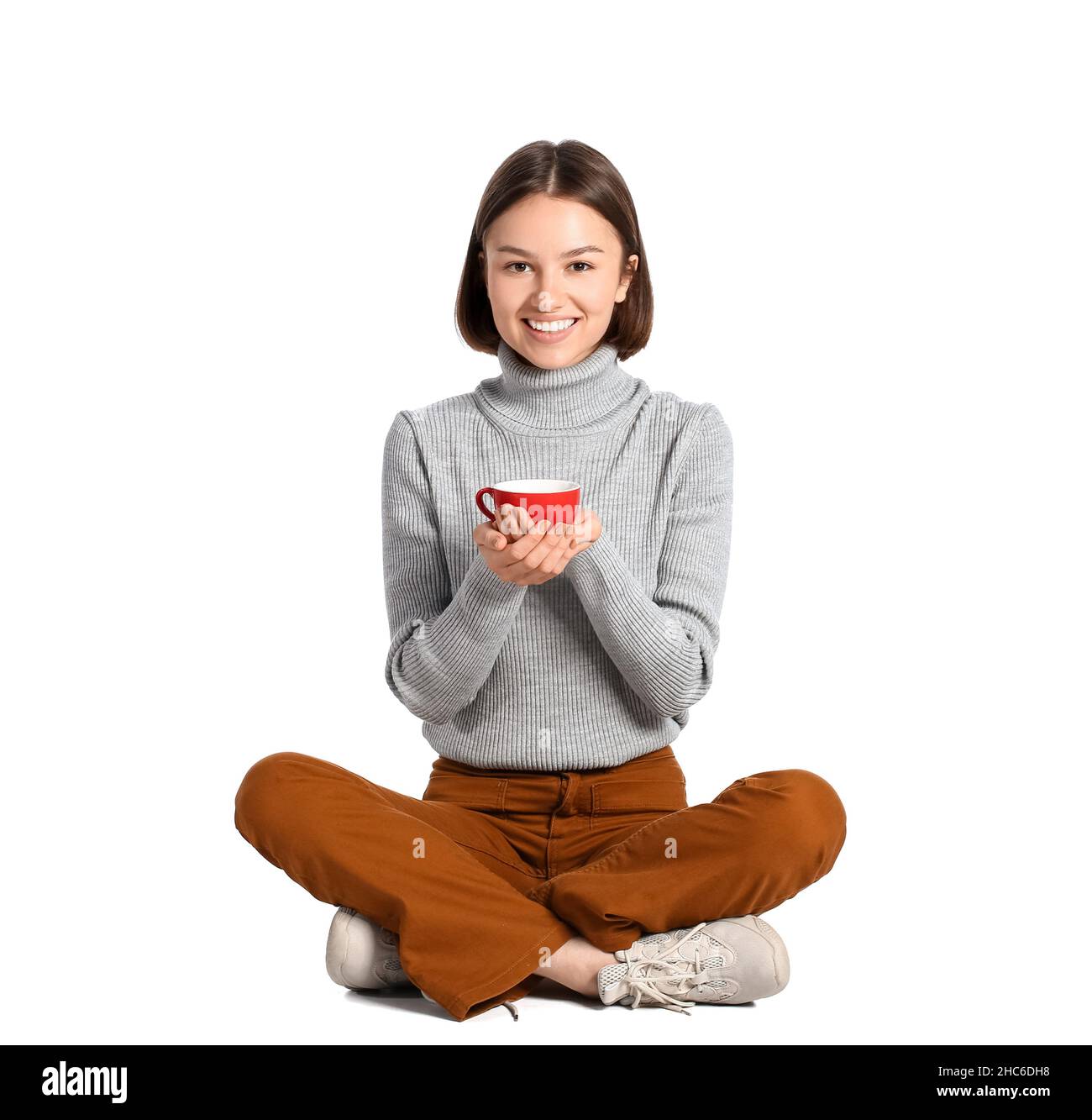Beautiful woman with cup of coffee on white background Stock Photo - Alamy