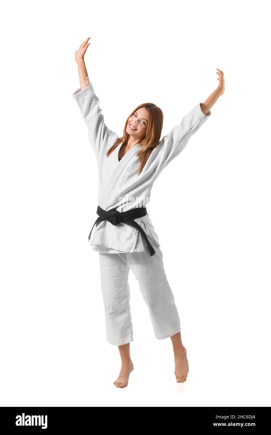 Happy female karate instructor on white background Stock Photo Alamy