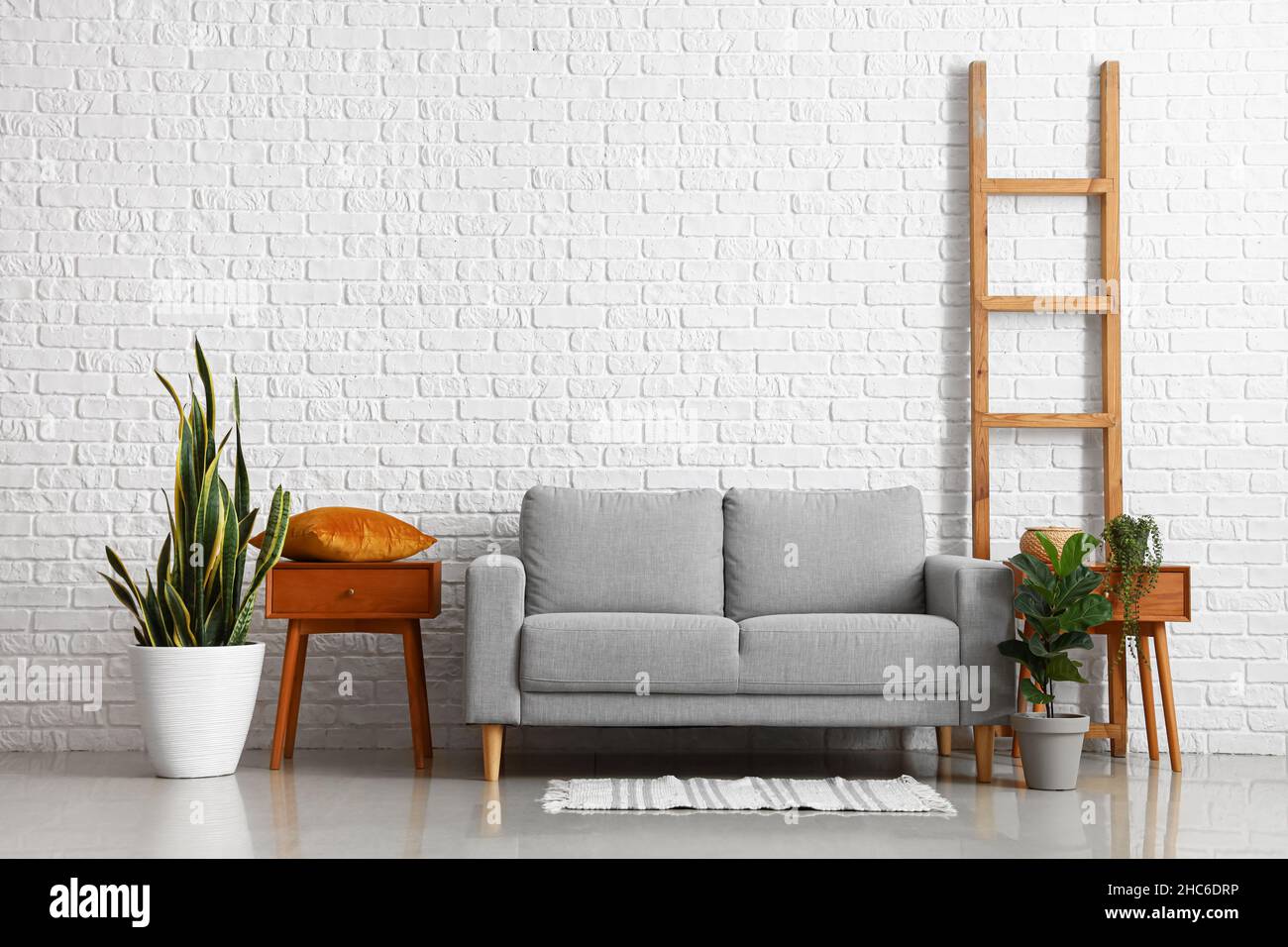 Interior of stylish living room with wooden table and sofa Stock Photo ...