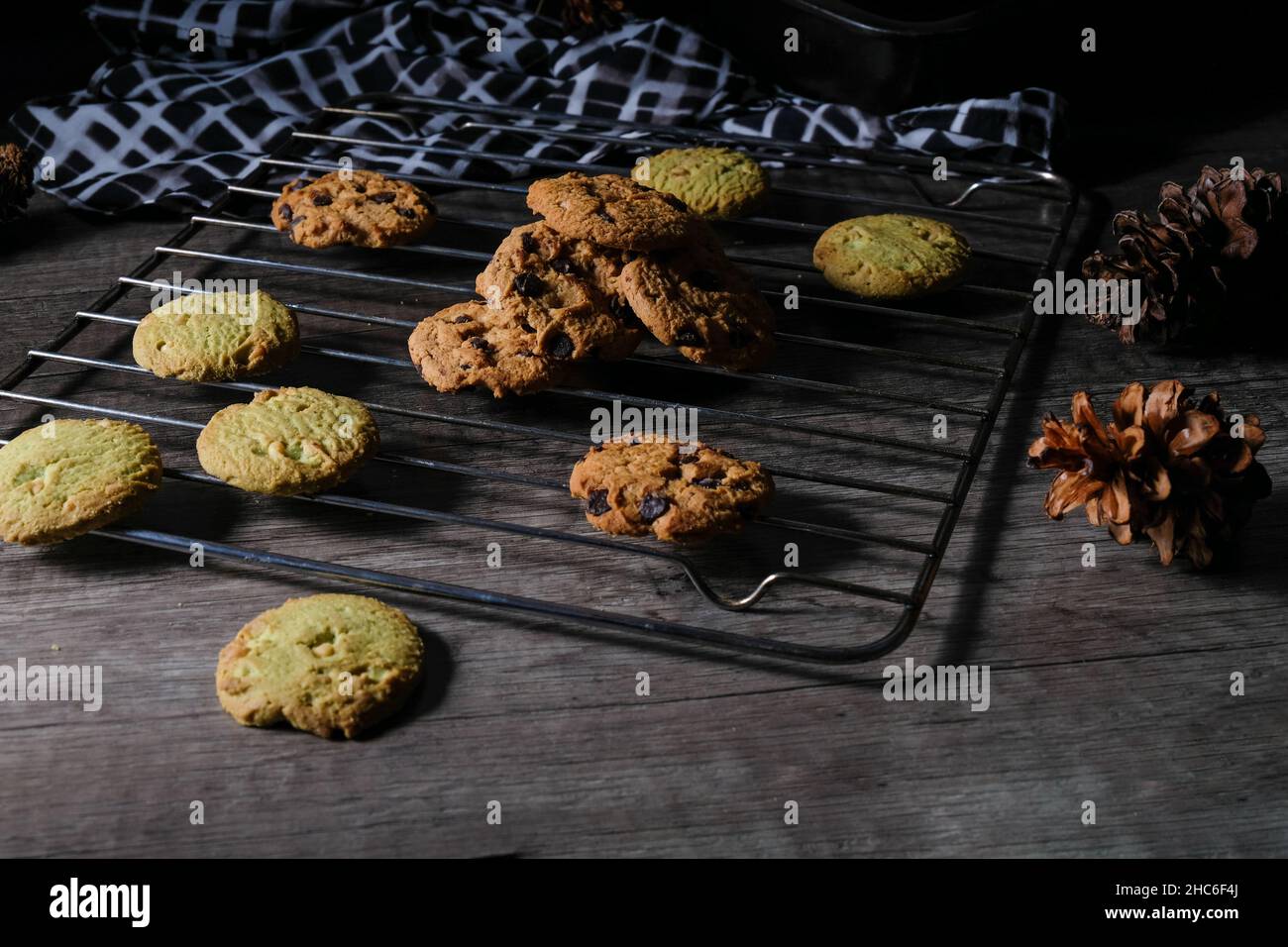 Chocolate cookies, on a cooling tray, photo of dark shades - dark mood Stock Photo