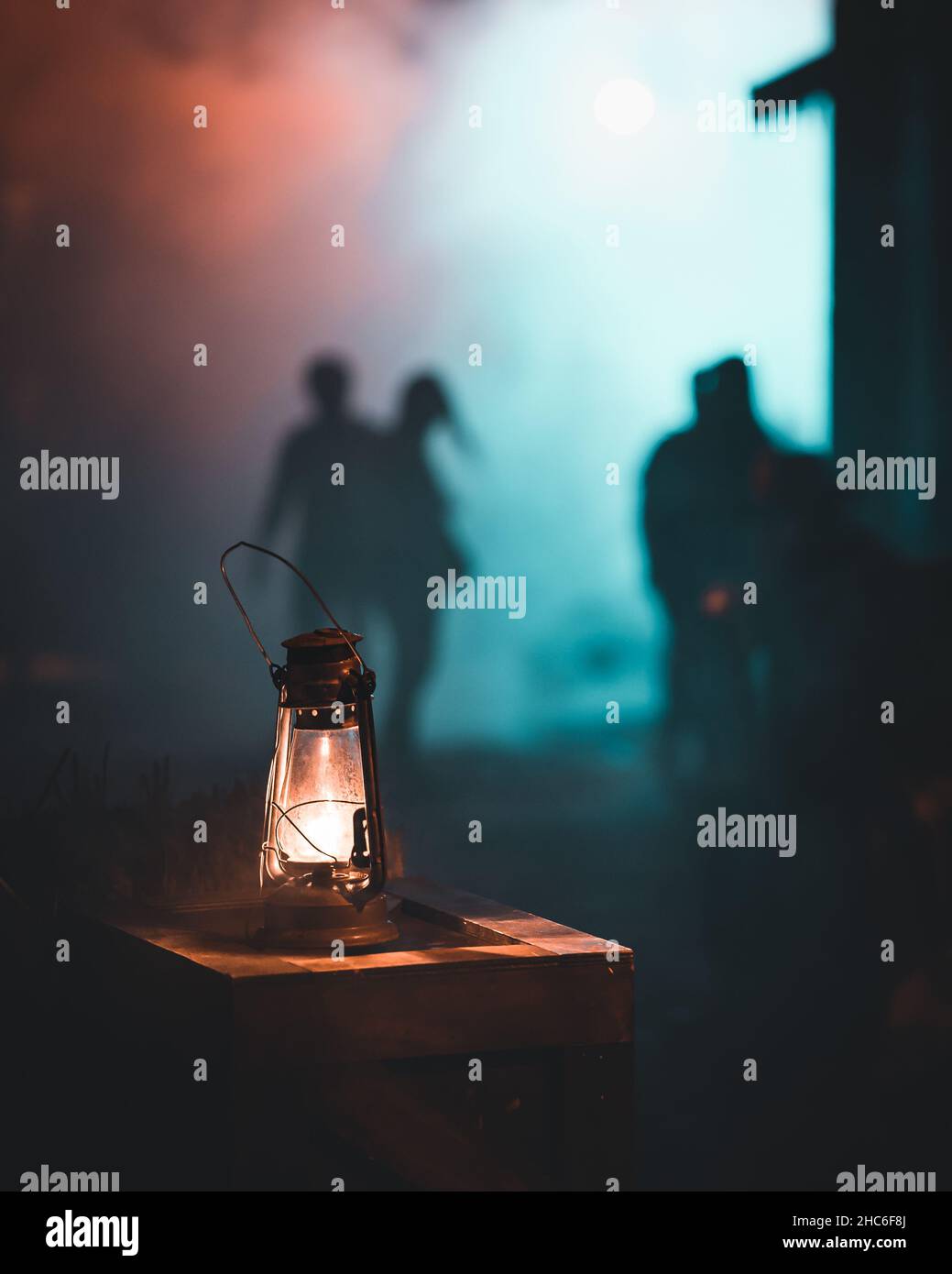 Lamp shining the way in the mysterious alley and people on the ...