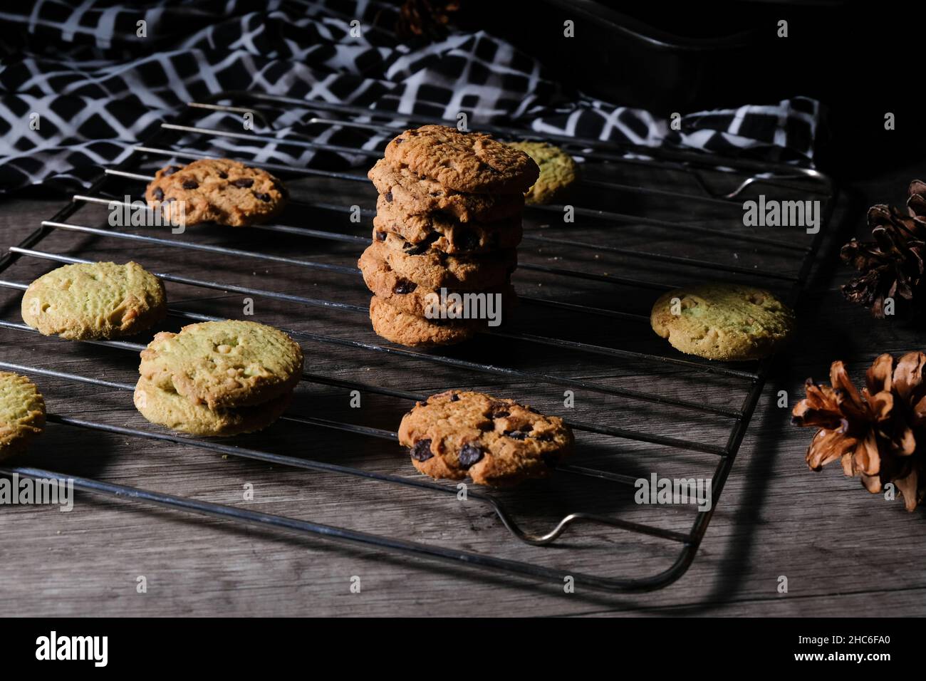 Chocolate cookies, on a cooling tray, photo of dark shades - dark mood Stock Photo