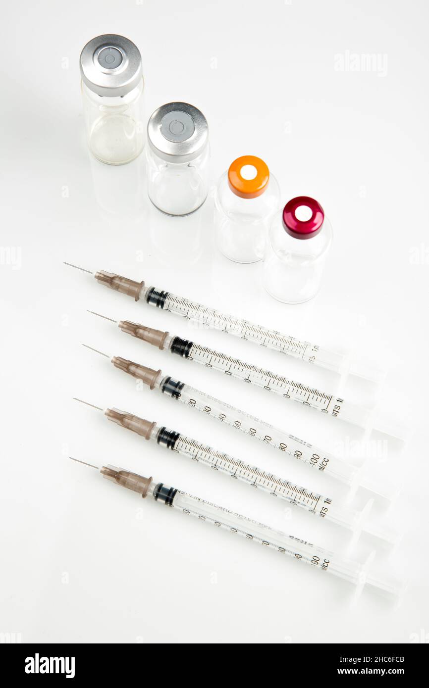 Top view of a medical syringes and ampoules on a white background Stock Photo