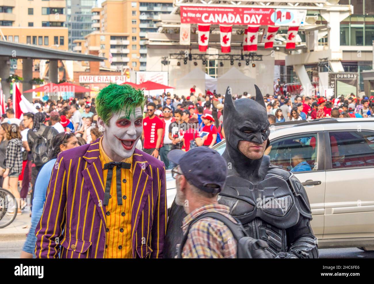 Canada Day celebrations in Toronto: Busker performers Batman and Joker in Dundas Square Stock Photo