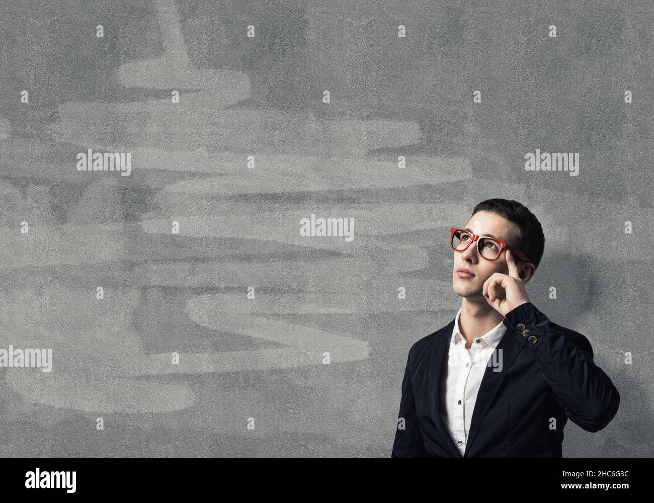 Young man thinking outside box hi-res stock photography and images - Alamy