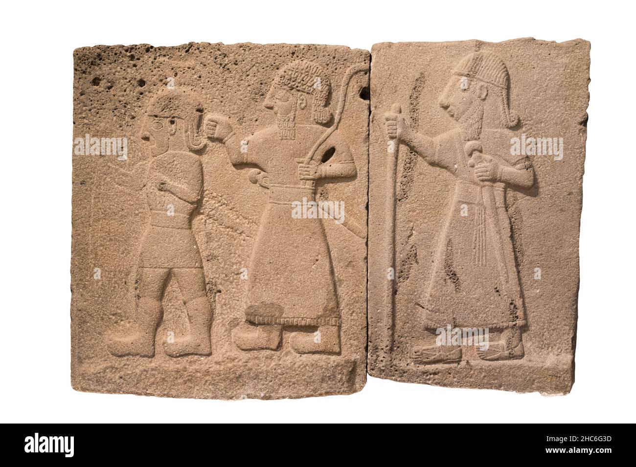 Ancient basalt relief of three warriors marching from the Hittite period. 9th centuries BCE. Stock Photo