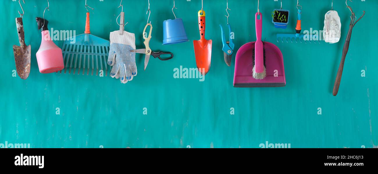 Hanging gardening utensils, springtime gardening, panoramic,large free copy space Stock Photo