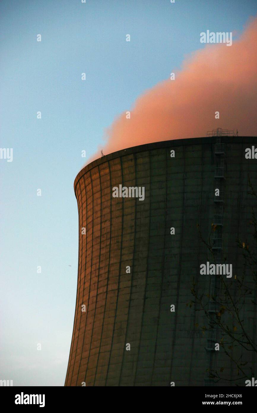 Vertical shot of smoke coming out from a power plant chimney Stock Photo