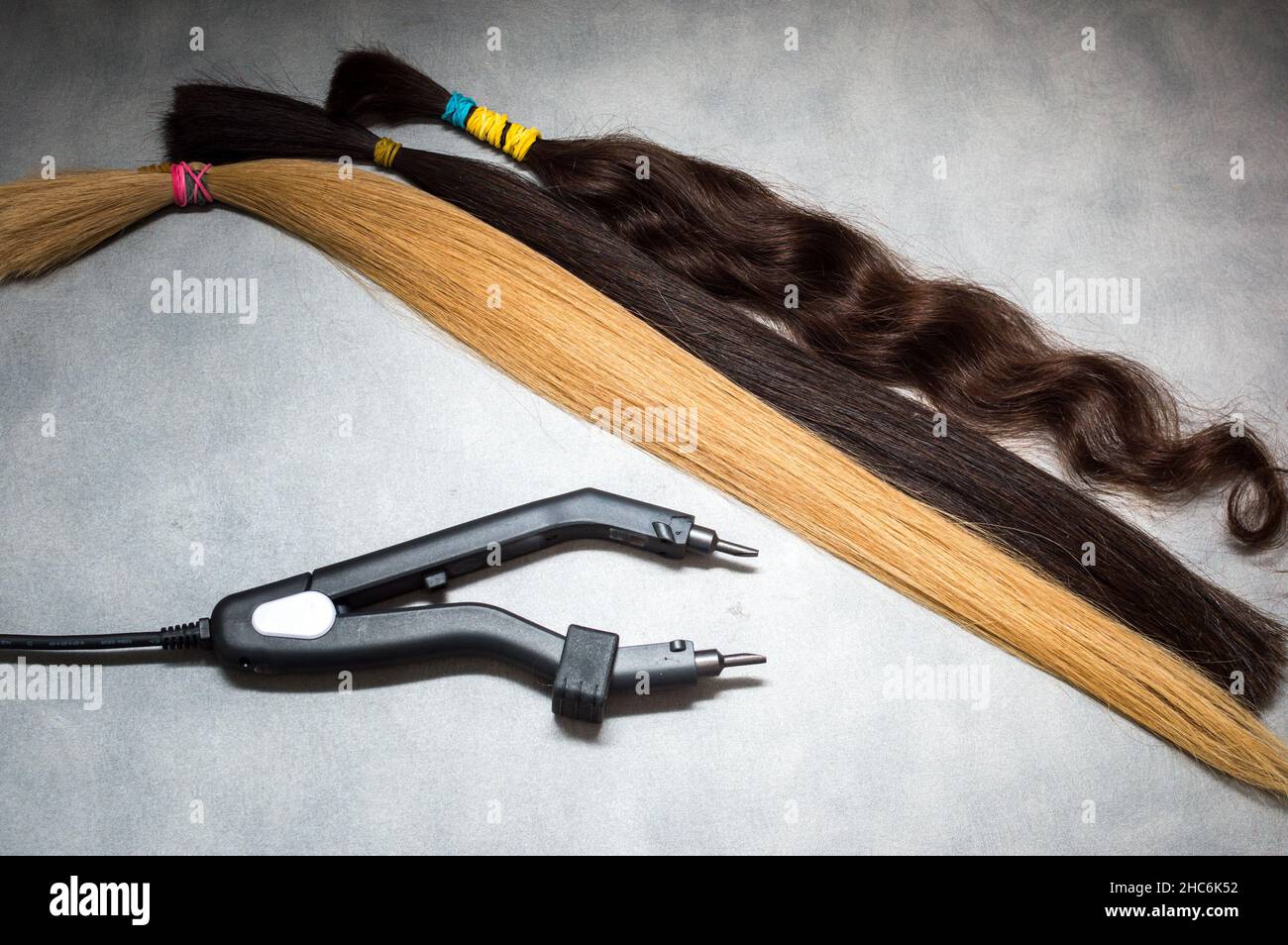 Hair strands and equipment with hot technique closeup Stock Photo Alamy