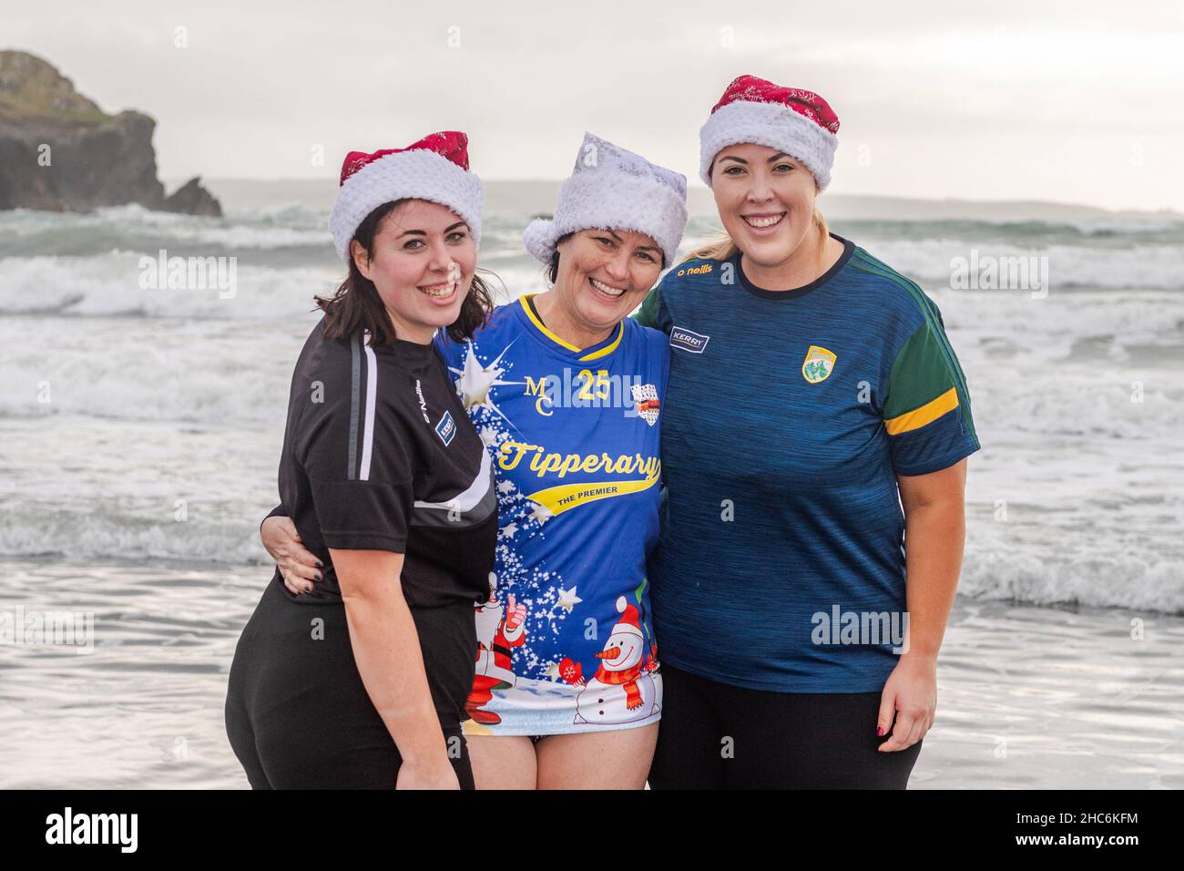 Rosscarbery, West Cork, Ireland. 25th Dec, 2021. Hundreds of people descended on The Warren Beach this morning to partake in a Christmas swim in aid of Rosscarbery Social Services & CRY (Cardiac Risk in the Young). At the swim were Denise, Eilish and Caitriona Brennan from Cork. Credit: AG News/Alamy Live News Stock Photo