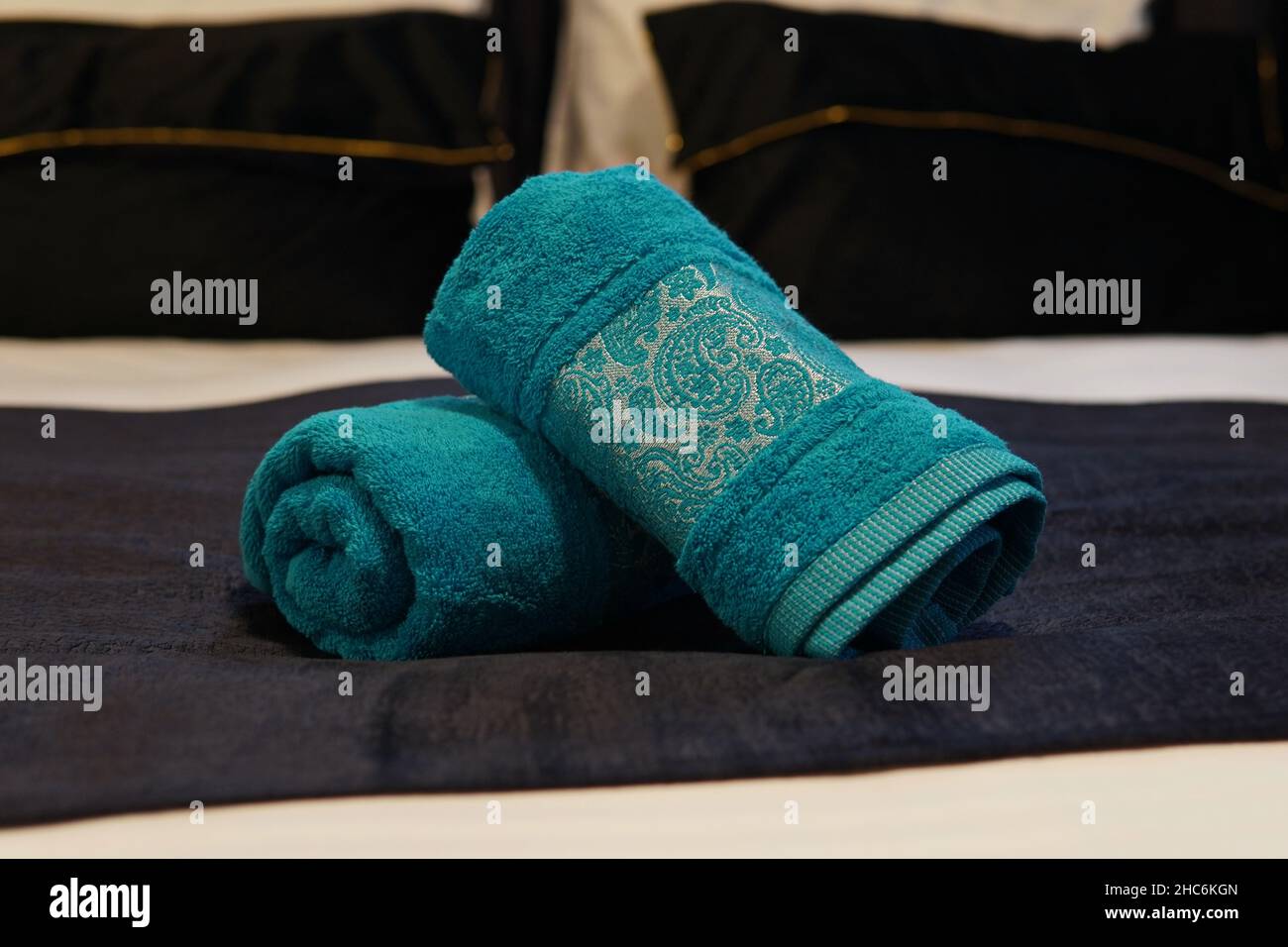 Closeup of the blue folded towels on the hotel bed Stock Photo