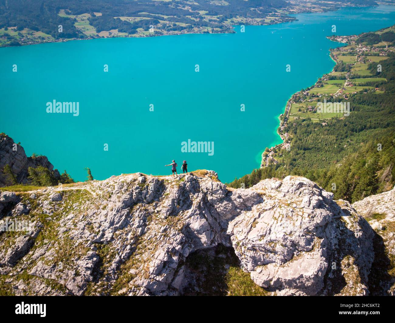Two people standing on top of the Schoberstein summit at the Attersee in Upper Austria, Austria Stock Photo