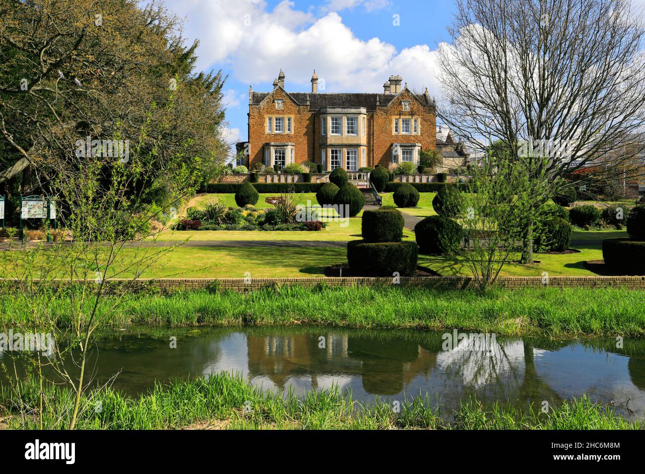 Summer view of Edgerton Lodge and memorial gardens, market town of