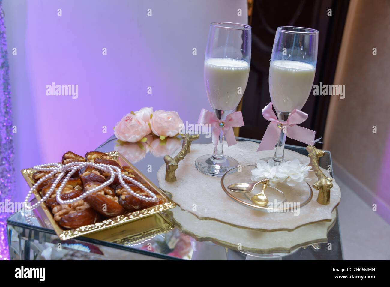 Dates and milk served to the groom and bride in the Moroccan wedding, the tradition of the Arab wedding Stock Photo