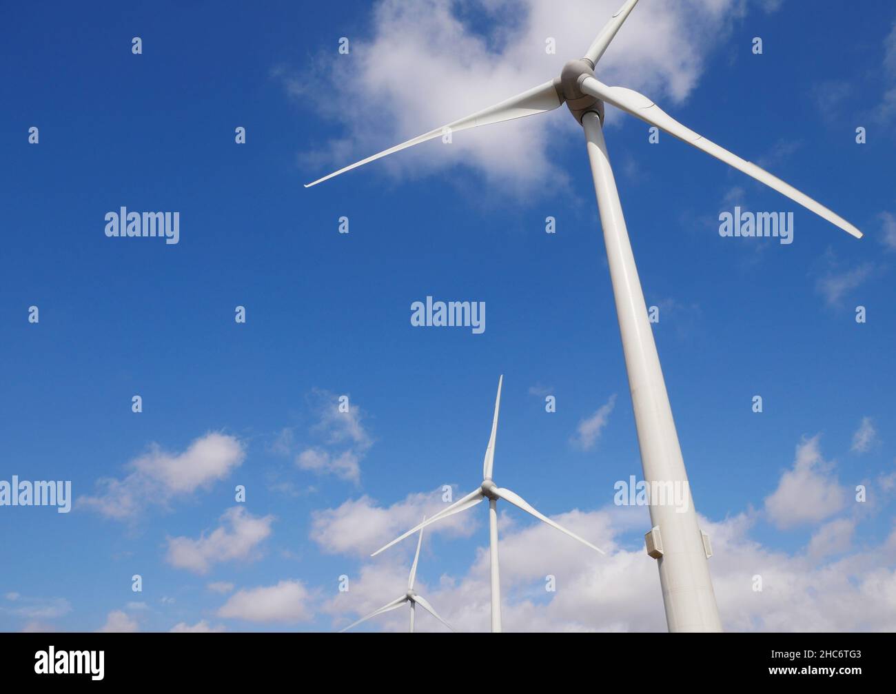Closeup shot of wind turbines on the background of heaven on a sunny ...