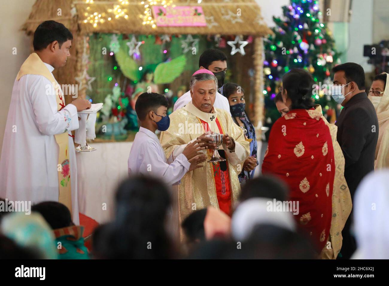 Bangladeshi Christian People offering prayer in Church during Christmas