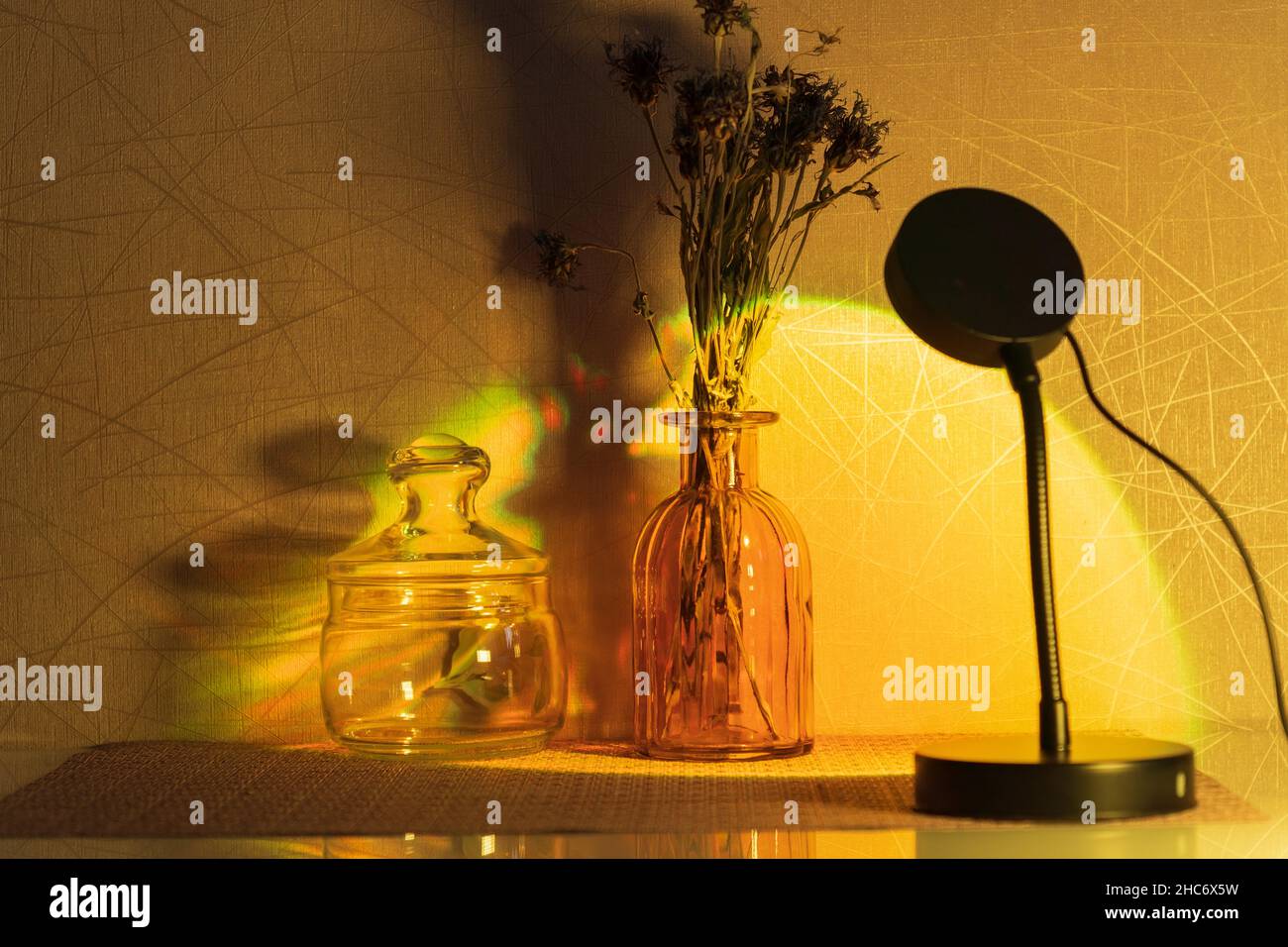Sunset projector lamp on the table. Multi colored RGB light. Home decor. Copy space Stock Photo