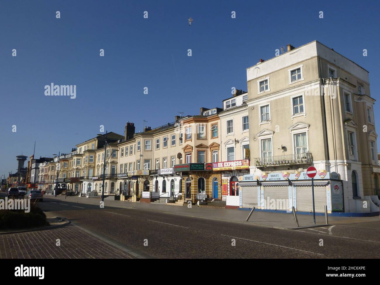 Restaurants and food outlets in a row of terraced seafront properties in Great Yarmouth, UK Stock Photo