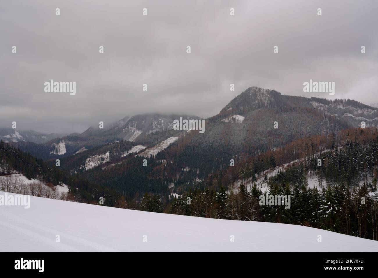 Scenic view of mountains against cloud sky Stock Photo