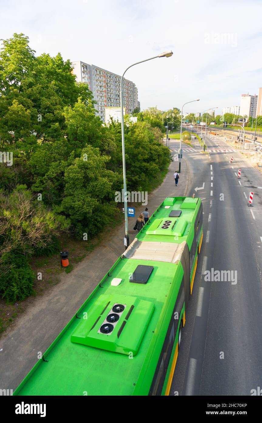 Green tram on road in Poznan, Poland Stock Photo