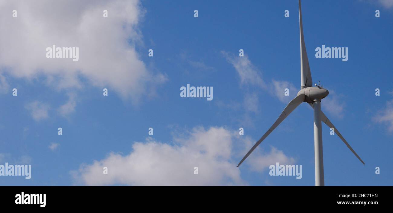 Closeup shot of a wind turbine on the background of heaven on a sunny ...